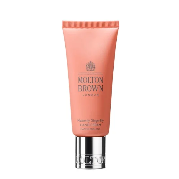 Molton Brown - Heavenly Gingerlily Hand Cream in orangefarbener Tube mit silbernem Verschluss auf weißem Hintergrund